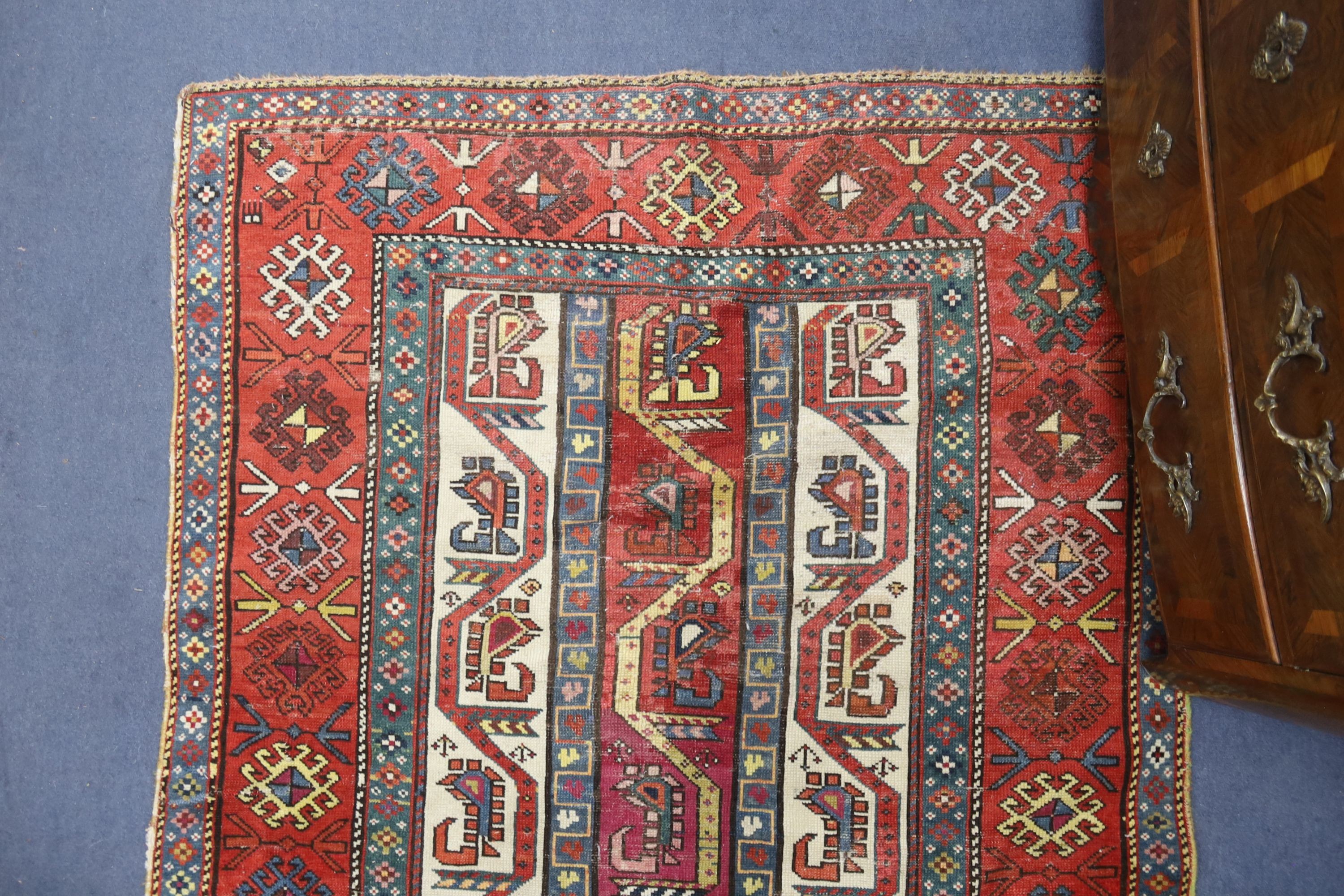 A Caucasian geometric rug, 284 x 118cm